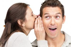 woman whispering to his partner