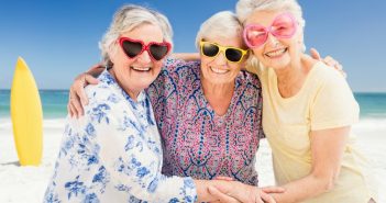 Ladies wearing sunglasses at the beach