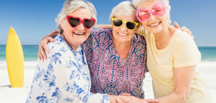 Ladies wearing sunglasses at the beach
