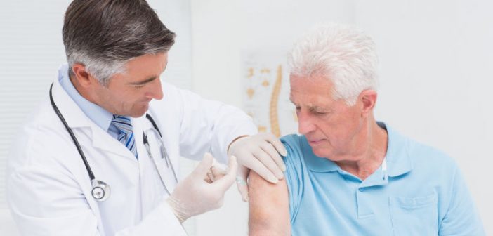 Senior man having vaccine