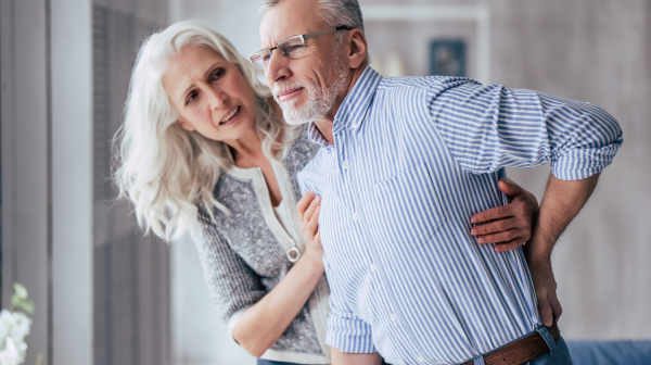 Man with his wife having back Pain