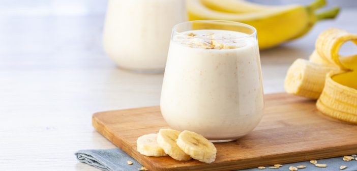 Banana and oatmeal smoothie in glass jar