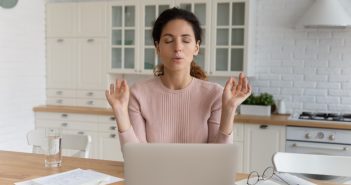 woman sitting trying to control anxiety